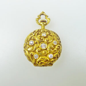 turn of the century open face diamond lapel watch